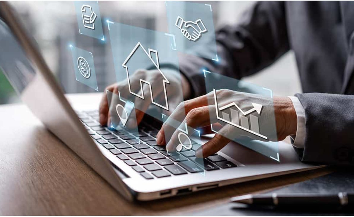 An agent typing on a laptop, with icons for homes, listings, deals and market trends floating above the keyboard